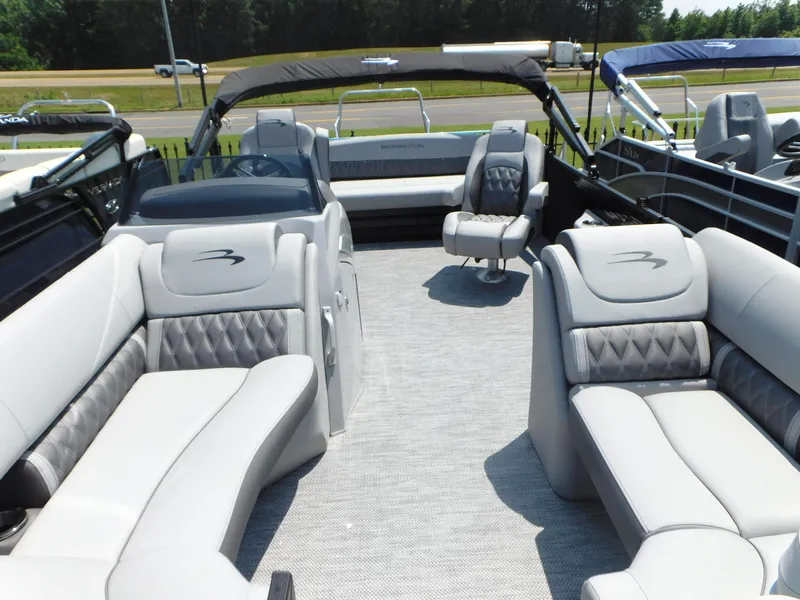 Slide: The Image of 2023 Bennington 24 LXSB pontoon boat with luxurious seating and modern design. - 6