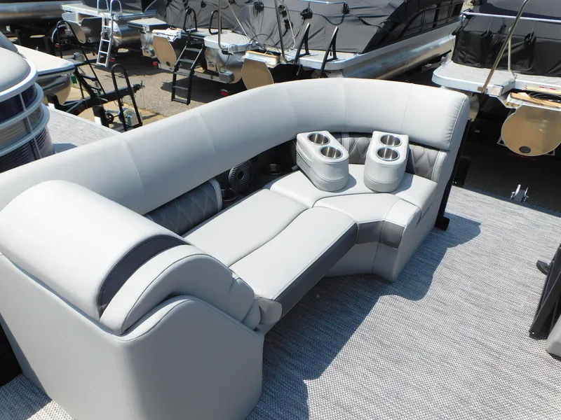 Slide: The Image of 2023 Bennington 24 LXSB boat with luxurious seating and cup holders. - 8