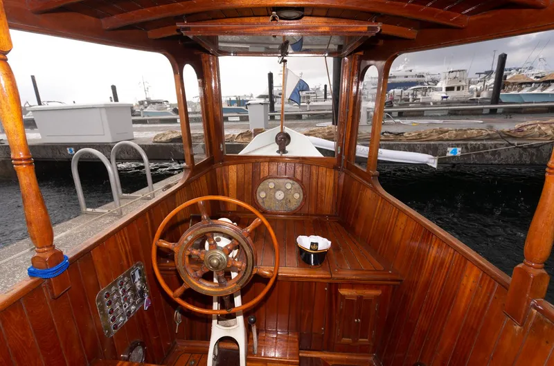 Slide: The Image of 1910 Classic Gentleman’s Commuter yacht with wooden interior at a marina. - 10