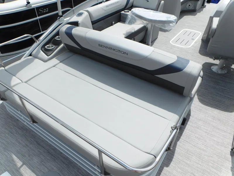 Slide: The Image of 2023 Bennington 22 SX Swingback boat interior with gray seating and modern design. - 6