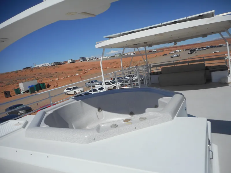 Slide: The Image of 2005 Twin Anchors Caspian share #9 houseboat with rooftop hot tub in desert setting. - 24