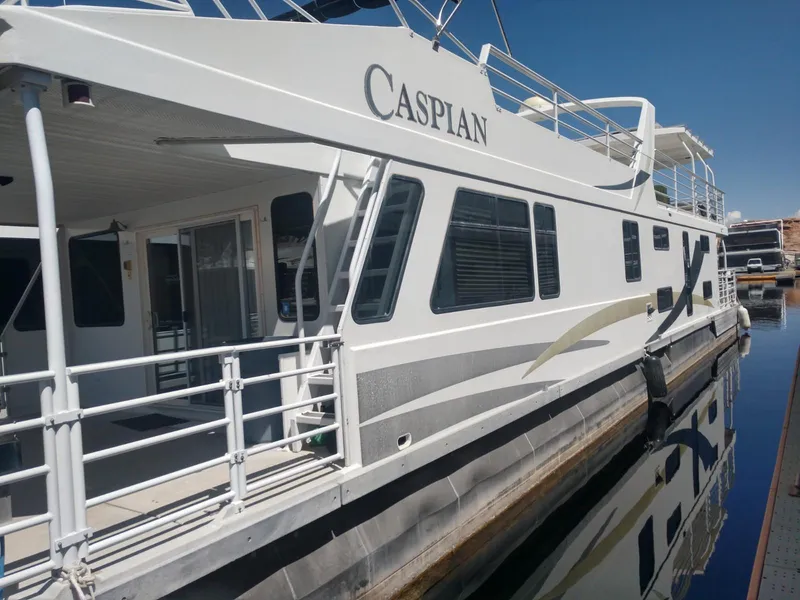 Slide: The Image of 2005 Twin Anchors Caspian share #9 houseboat docked in a marina. - 27