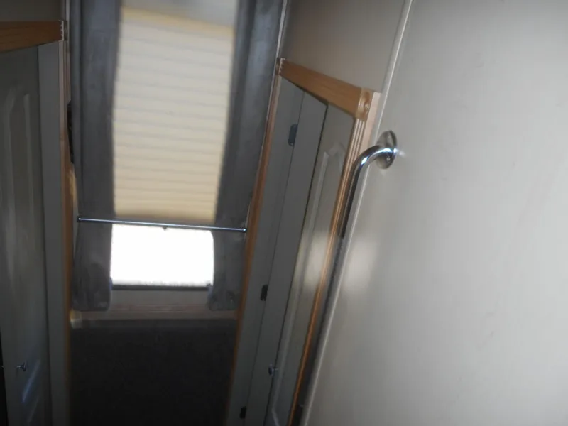 Slide: The Image of Narrow hallway inside 2005 Twin Anchors Caspian share #9 houseboat. - 6