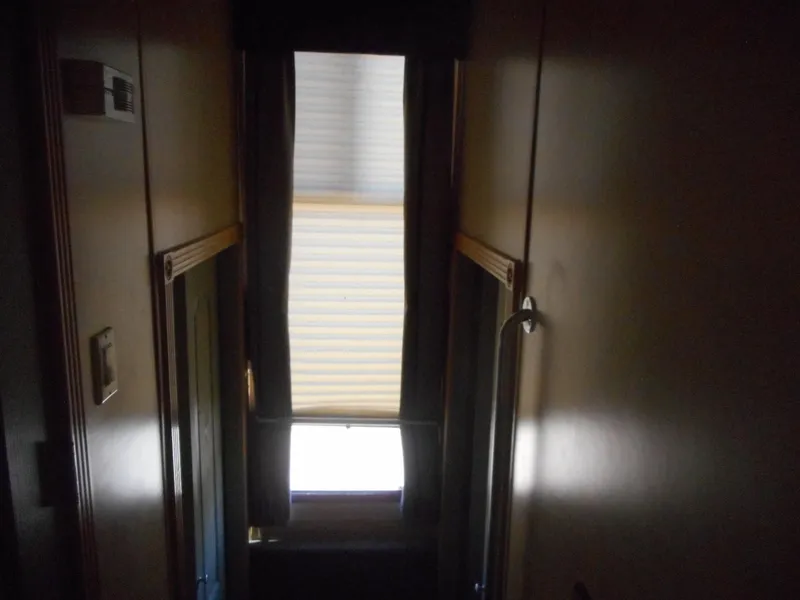 Slide: The Image of Narrow hallway inside 2005 Twin Anchors Caspian share #9 houseboat. - 7