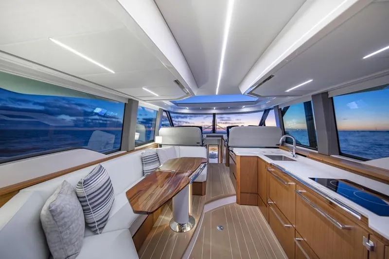 Slide: The Image of Luxurious interior of 2025 Tiara Yachts EX60 with panoramic ocean views. - 20