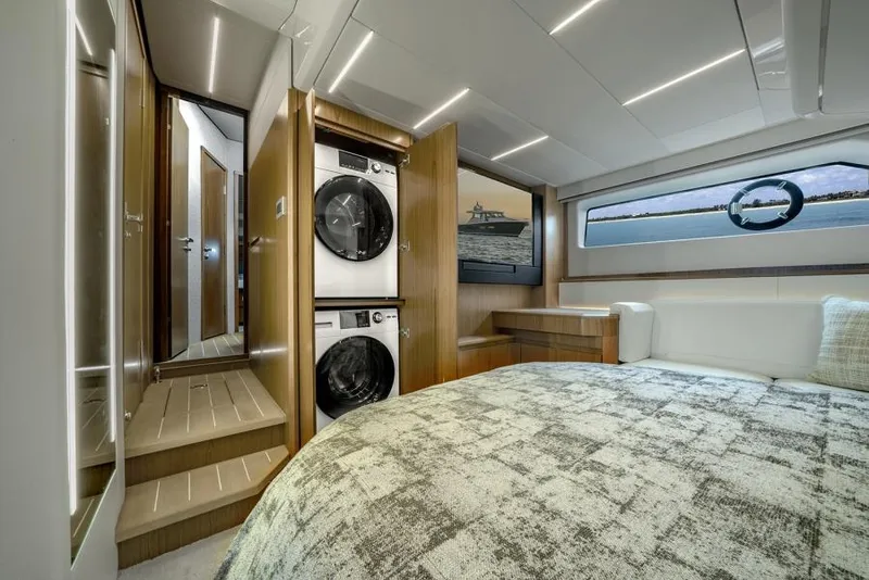 Slide: The Image of Luxury bedroom interior of 2025 Tiara Yachts EX60 with washer and dryer. - 23