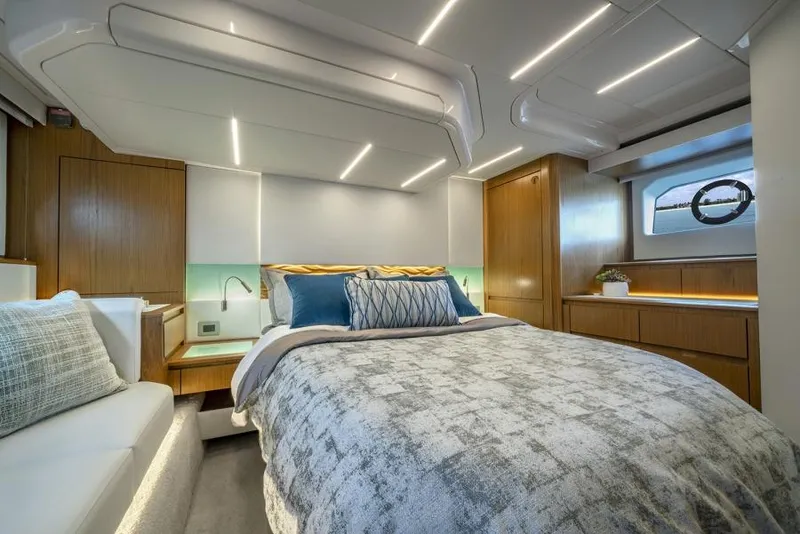 Slide: The Image of Luxurious bedroom interior of 2025 Tiara Yachts EX60 with modern lighting and elegant decor. - 27