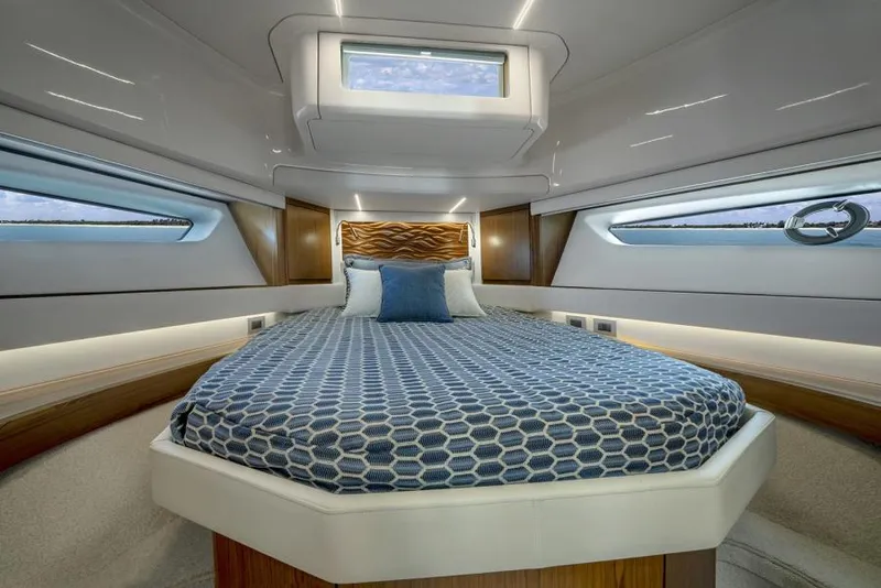 Slide: The Image of Luxurious bedroom interior of 2025 Tiara Yachts EX60 with modern design and ample natural light. - 28
