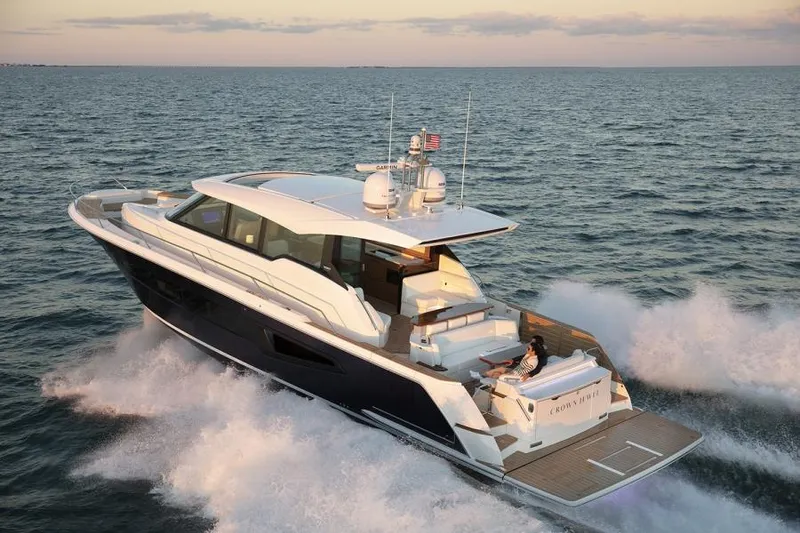 Slide: The Image of 2025 Tiara Yachts EX60 cruising on open water. - 3