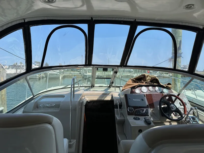 Slide: The Image of Interior view of 2008 Sea Ray 330 Sundancer yacht cockpit with steering wheel and dashboard. - 11