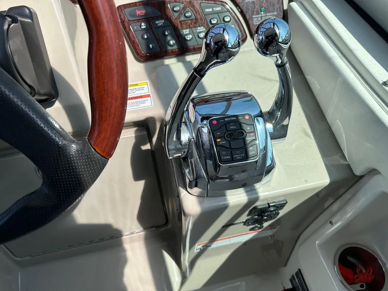 Slide: The Image of Close-up of 2008 Sea Ray 330 Sundancer helm controls and steering wheel. - 15