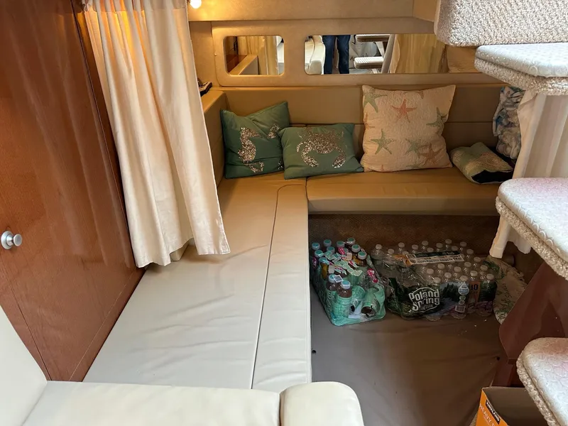 Slide: The Image of Interior of 2008 Sea Ray 330 Sundancer with seating area and storage. - 25