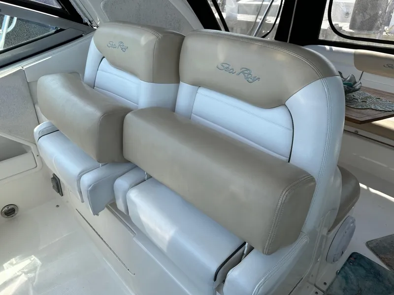 Slide: The Image of 2008 Sea Ray 330 Sundancer boat seats in beige and white. - 7