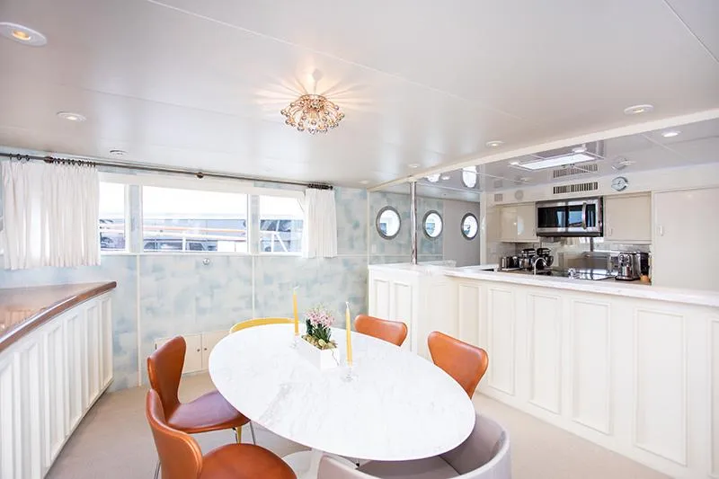 Slide: The Image of Interior of a 1966 Burger Classic yacht with modern kitchen and ocean views. - 13
