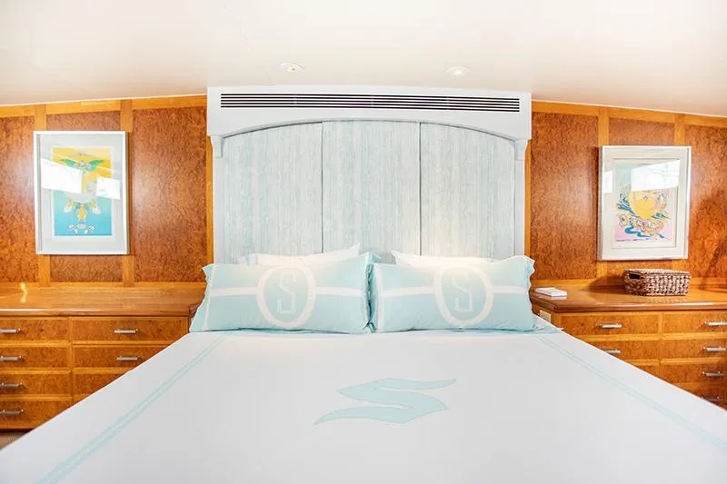 Slide: The Image of Modern bathroom with glass shower, wooden countertop, and white cabinetry in a 1966 Burger Classic. - 19