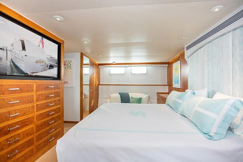Slide: The Image of Cozy bedroom in a 1966 Burger Classic yacht with elegant decor and soft lighting. - 20