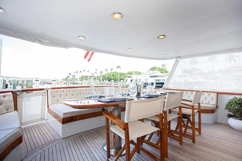 Slide: The Image of Luxurious 1966 Burger Classic yacht interior with modern seating, vibrant decor, and ocean view. - 4