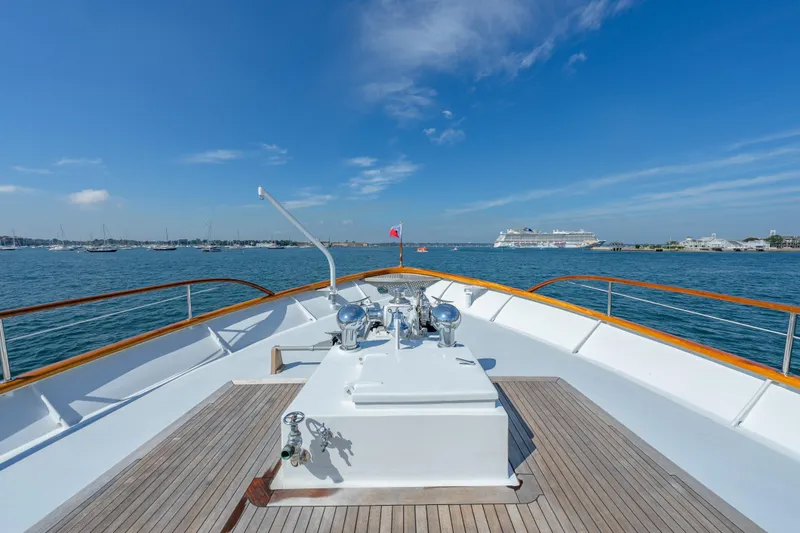 Slide: The Image of Bow view of 1966 Burger Classic yacht on calm sea under clear blue sky. - 43