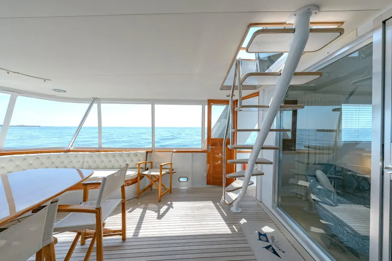 Slide: The Image of Luxurious 1966 Burger Classic yacht interior with elegant seating and ocean view. - 46
