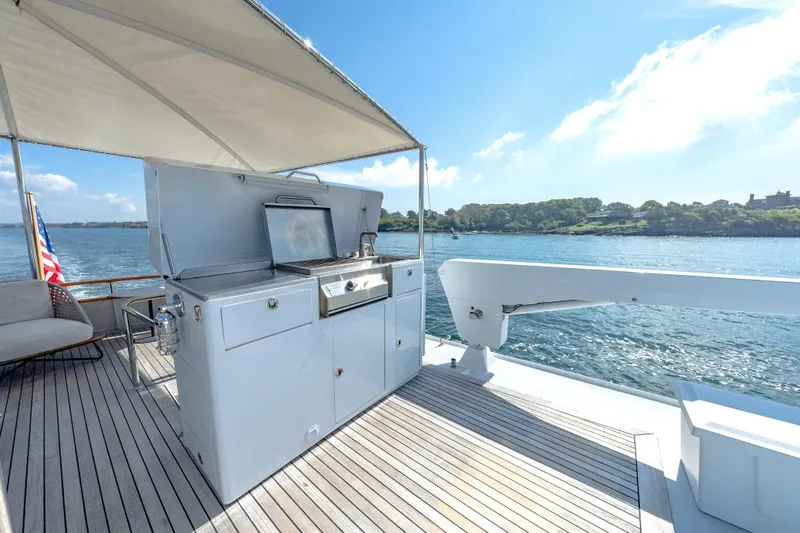 Slide: The Image of Outdoor kitchen on 1966 Burger Classic yacht with scenic water view. - 49