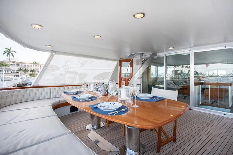 Slide: The Image of Luxurious interior of a 1966 Burger Classic yacht with modern seating and bar area. - 6
