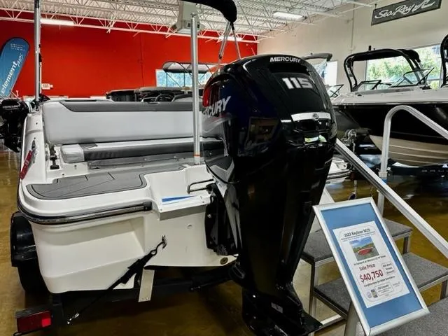 Slide: The Image of 2023 Bayliner Element M19 boat with Mercury 115 engine displayed in showroom. - 4