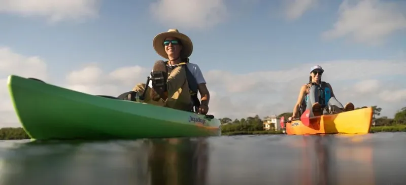 Slide: The Image of Two people kayaking on Liquidlogic Manta Ray Propel 12 kayaks, 2023 model. - 8