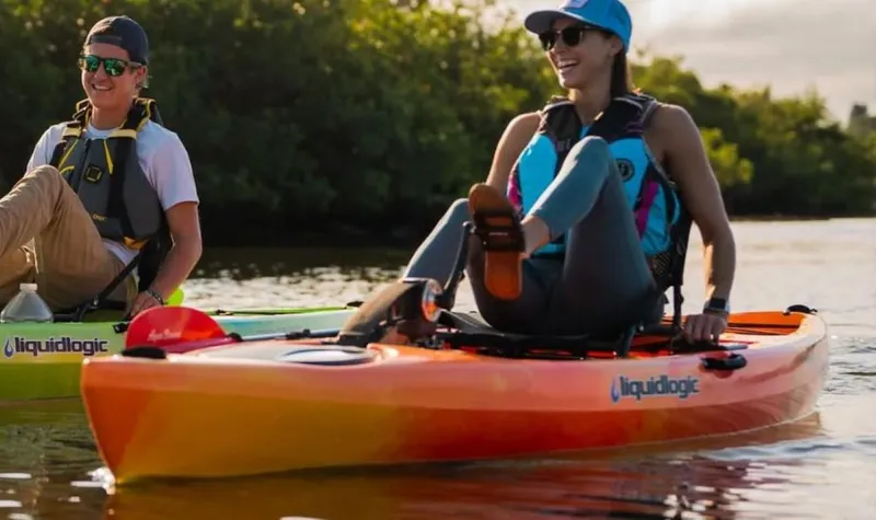 Slide: The Image of Two people kayaking on Liquidlogic Manta Ray Propel 12 kayaks, 2023 model. - 5