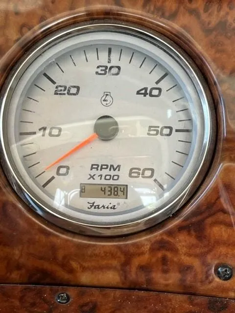 Slide: The Image of Close-up of a 2005 Rinker Fiesta Vee 320 RPM gauge showing 438.4 hours. - 14