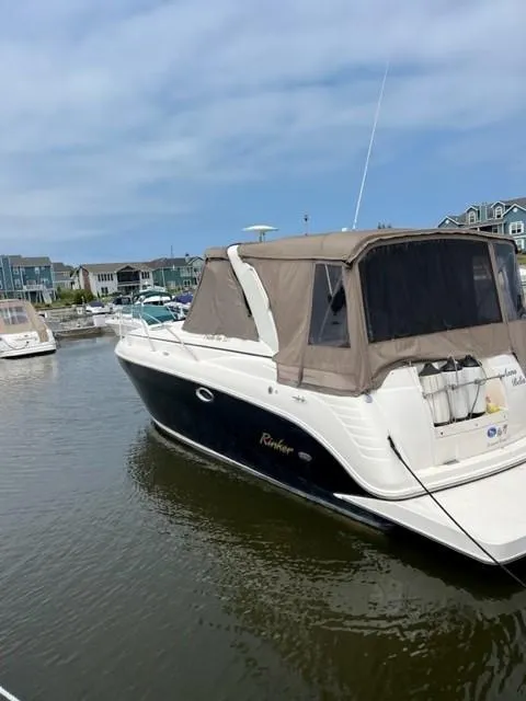 Slide: The Image of 2005 Rinker Fiesta Vee 320 boat docked in a marina. - 16