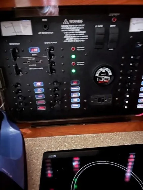 Slide: The Image of Electrical control panel of a 2005 Rinker Fiesta Vee 320 boat. - 20