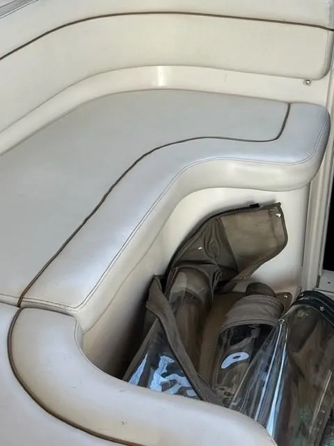 Slide: The Image of White leather seating on a 2005 Rinker Fiesta Vee 320 boat. - 22