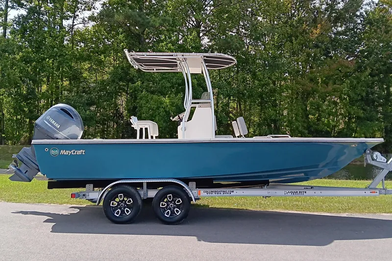 The Image of 2023 May-Craft 220 Bay boat on trailer, featuring Yamaha outboard motor. - 0