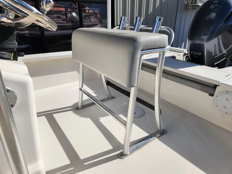 Slide: The Image of 2023 May-Craft 220 Bay boat interior with cushioned seating and rod holders. - 22