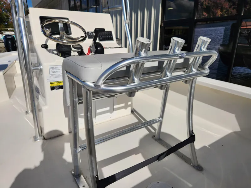 Slide: The Image of 2023 May-Craft 220 Bay boat console with rod holders and steering wheel. - 23