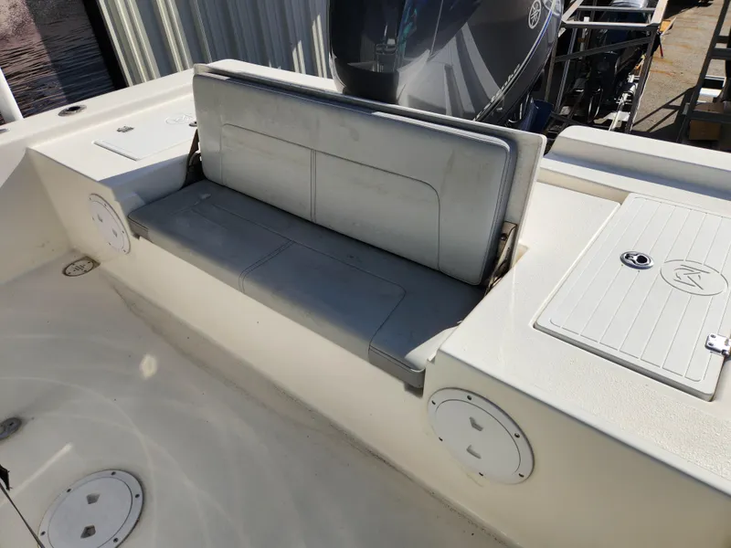 Slide: The Image of 2023 May-Craft 220 Bay boat interior with seating and storage compartments. - 25