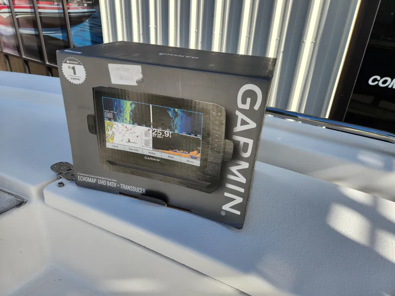 Slide: The Image of Boxed Garmin fishfinder on 2023 May-Craft 220 Bay boat deck. - 29