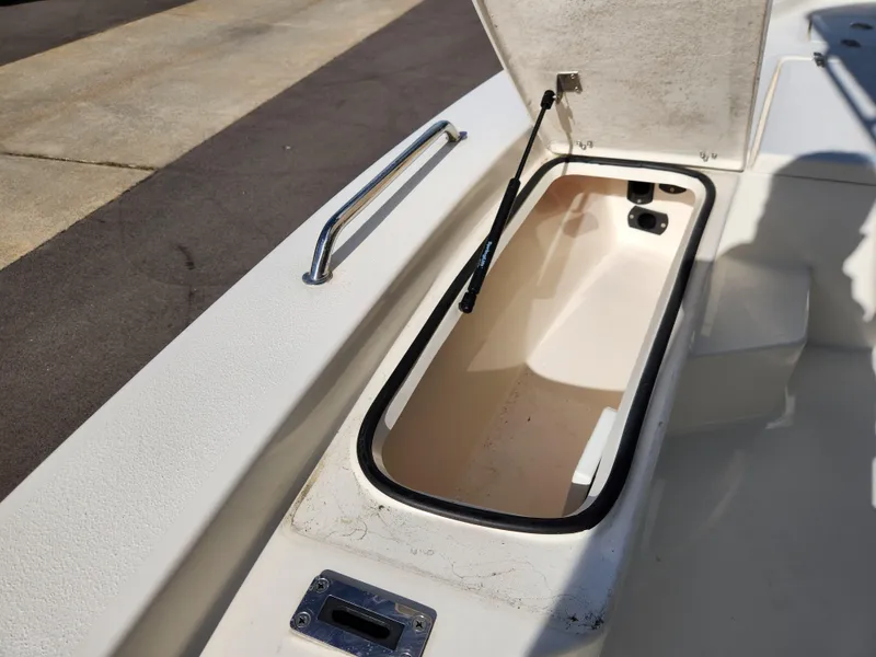 Slide: The Image of Open storage compartment on 2023 May-Craft 220 Bay boat. - 8