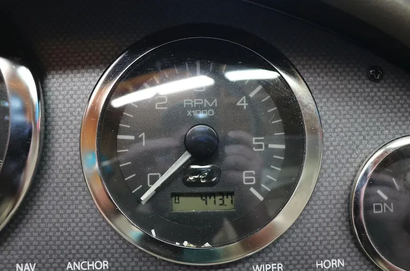 Slide: The Image of Close-up of 2005 Sea Ray 200 Sport RPM gauge showing 473.1 hours. - 13