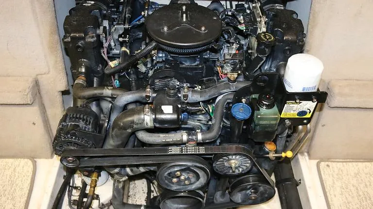 Slide: The Image of 2005 Sea Ray 200 Sport engine compartment with visible components and belts. - 15