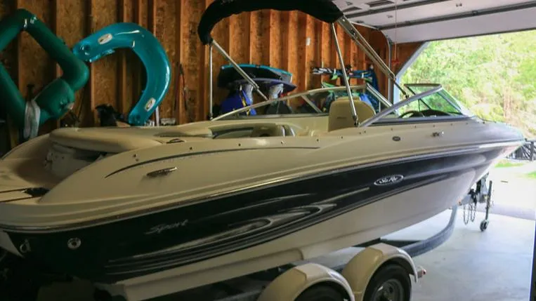 Slide: The Image of 2005 Sea Ray 200 Sport boat in a garage. - 16