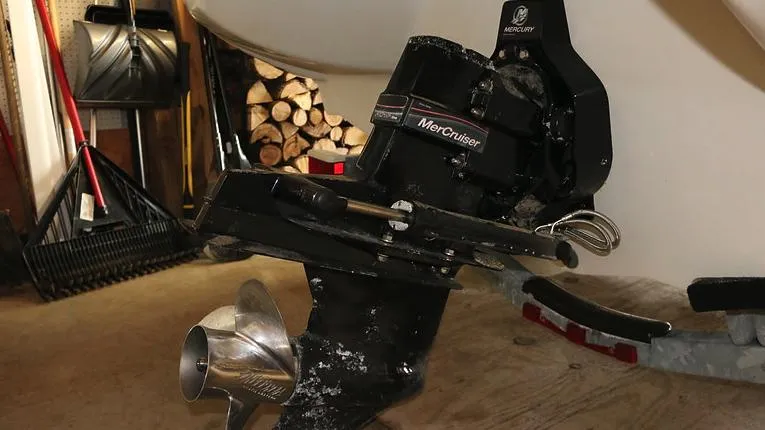 Slide: The Image of 2005 Sea Ray 200 Sport boat with MerCruiser engine in a garage. - 18