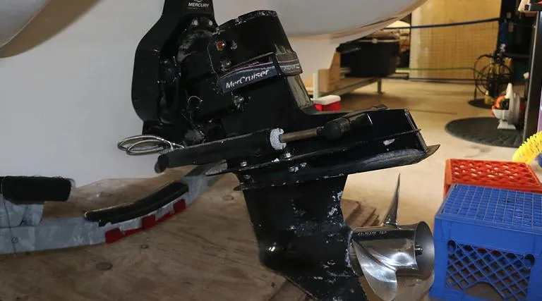 Slide: The Image of 2005 Sea Ray 200 Sport boat with MerCruiser outboard motor in a garage. - 19