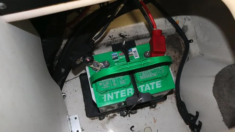 Slide: The Image of 2005 Sea Ray 200 Sport boat battery compartment with Interstate battery. - 20