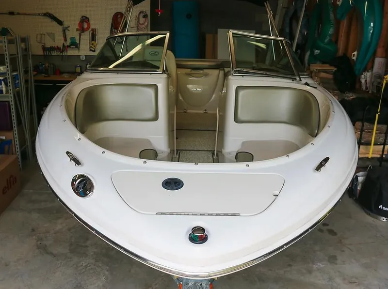 Slide: The Image of 2005 Sea Ray 200 Sport boat in a garage, front view. - 4