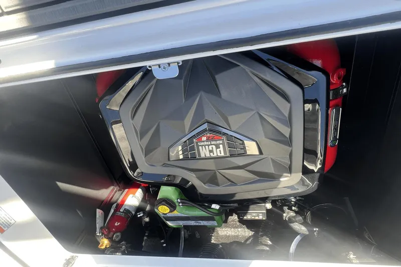 Slide: The Image of 2024 Nautique Super Air Nautique GS24 engine compartment with PCM engine visible. - 13