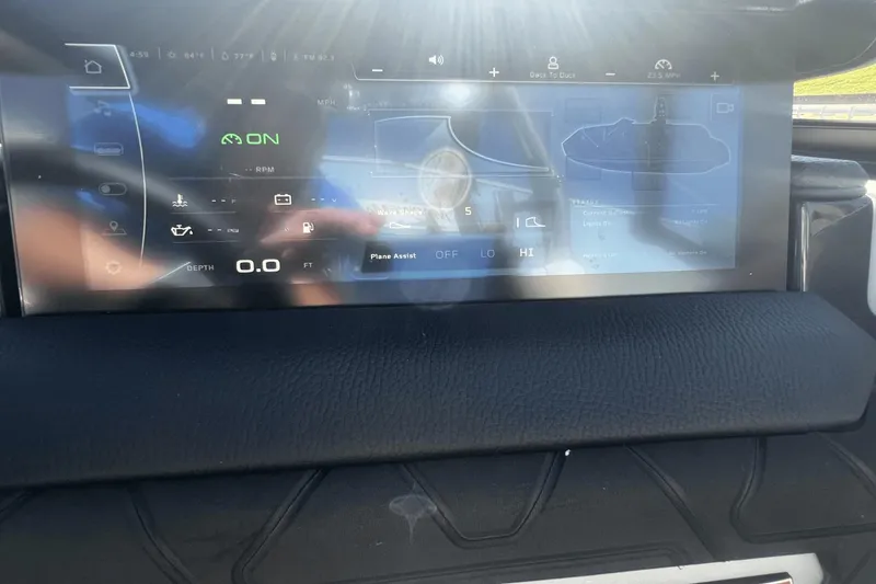 Slide: The Image of 2024 Nautique Super Air Nautique GS24 dashboard display with navigation and control features. - 4