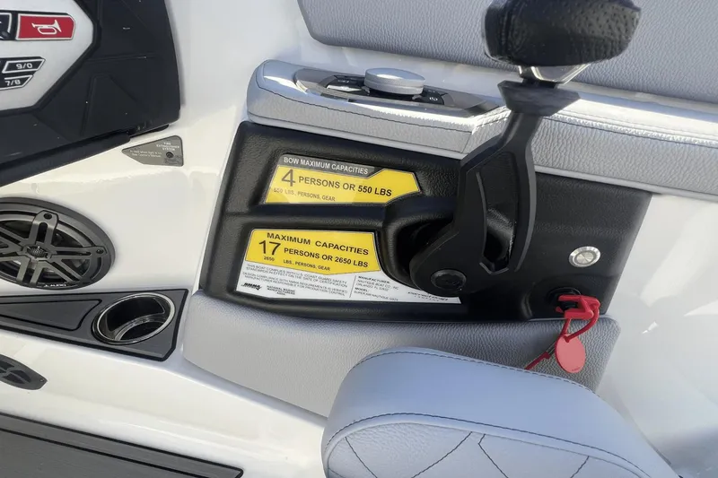Slide: The Image of 2024 Nautique Super Air Nautique GS24 boat controls and capacity labels. - 5