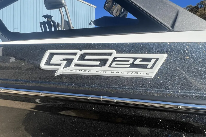 Slide: The Image of 2024 Nautique Super Air Nautique GS24 logo on a sparkling boat exterior. - 8