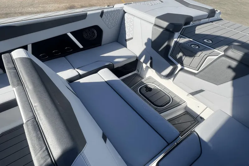 Slide: The Image of 2024 Nautique Super Air Nautique GS24 interior with sleek seating and modern design. - 9